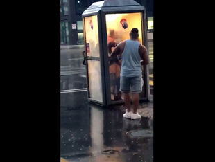 Brit duo humps in telephone booth in center of city